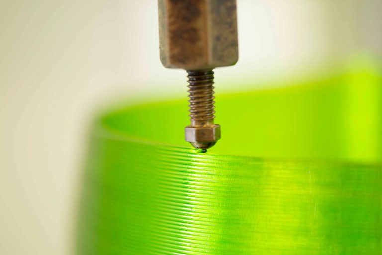 Close-up picture of a Signify luminaire being 3D printed. Photo provided by Signify.