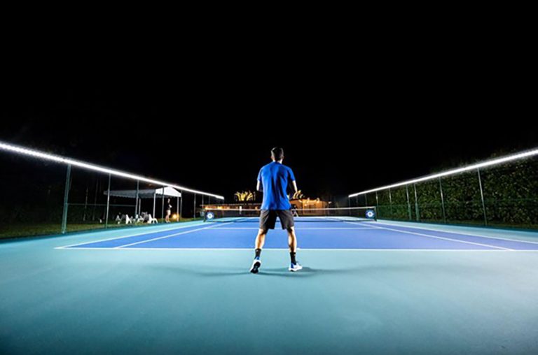 a lit up tennis court - photo courtesy of Tweener