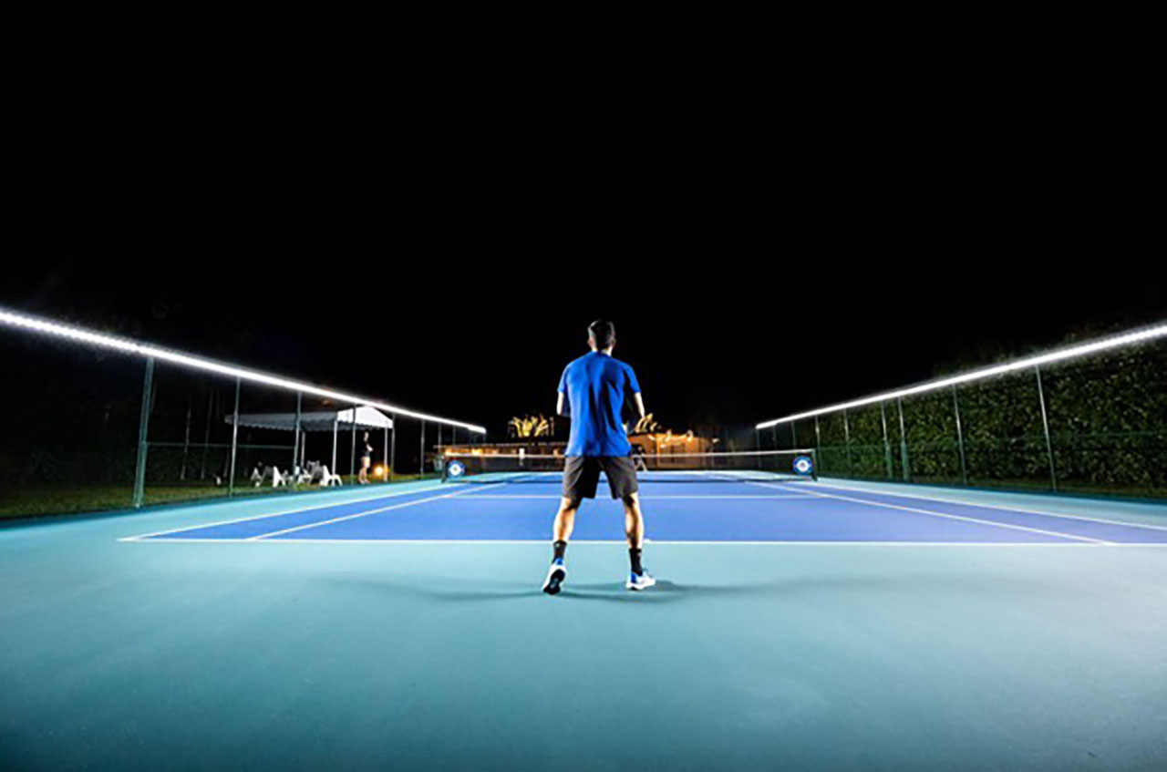 a lit up tennis court - photo courtesy of Tweener